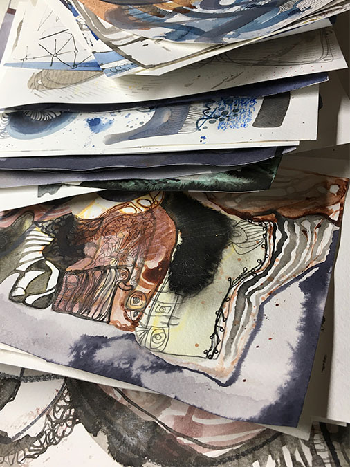 a stack of paintings